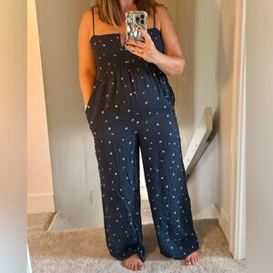 Navy Jumpsuit with White Floral Pattern, size M